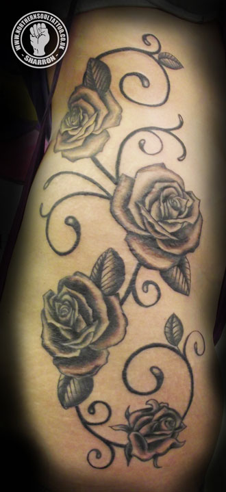 Roses covering the ribs and thigh This piece was finished by Sharron today